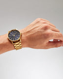 Nixon Sentry herreklokke i gullfarget stål (42mm)